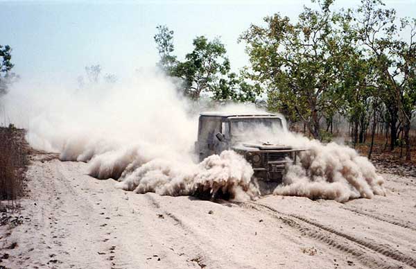 Vehicle plowing through bulldust
